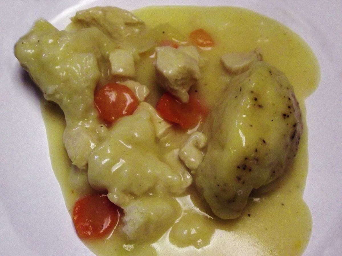 Traditional chicken and dumplings with vegetables.