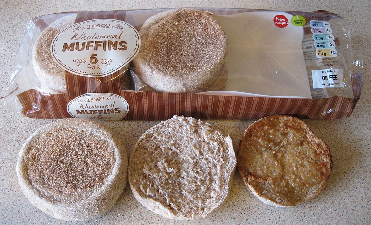 Packet of "Wholemeal" muffins, purchased in Tesco, Abingdon in the United Kindom. The photo contains a closed muffin, a bottom half, and ano