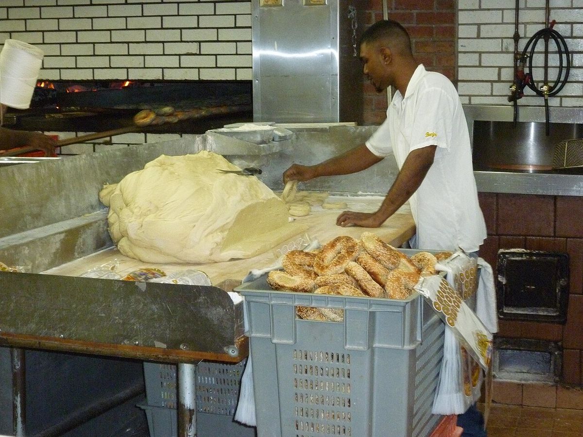 Fairmount Bagel - A huge loaf of bagel paste that is ready to be rolled and prepared.