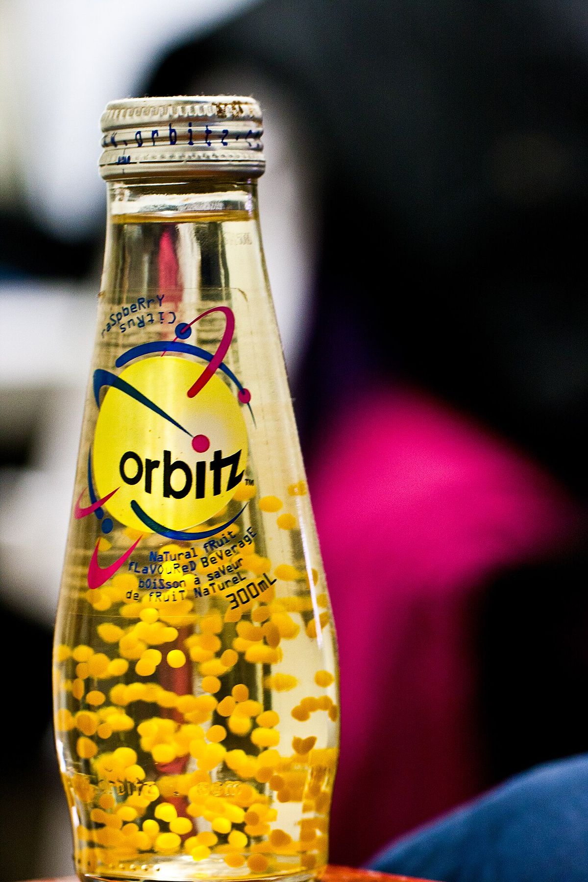 glass bottle full of yellow balls