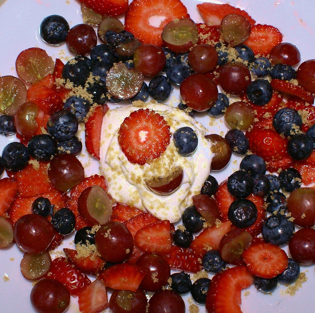 Mixed berries, dollop of light sour cream, sprinkling of brown sugar.