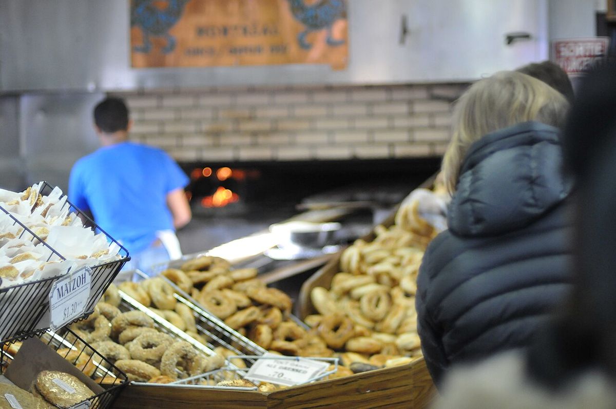 The saturday morning bagel queue, Rue St-Viateur, Montreal, Quebec, Canada. The title of this work at its source is: The Saturday Bagel Queu