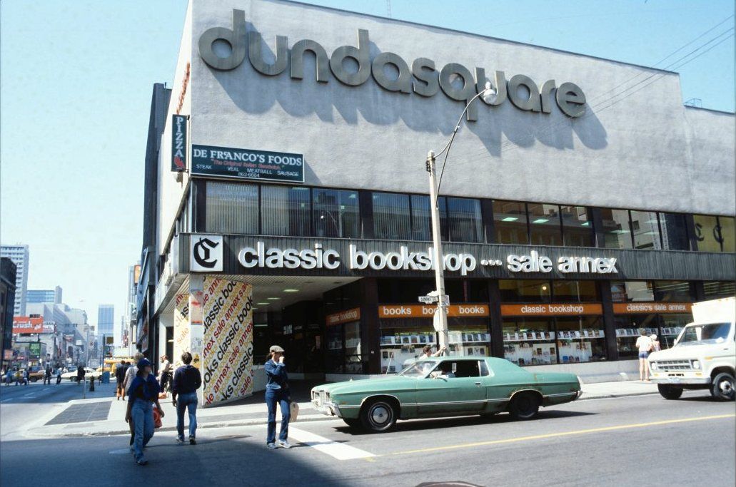 Looking north on Yonge Street at its intersection with the side street called Dundas Square. The building called Dundas Square, containing a